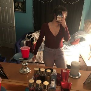 Long sleeve maroon body suit